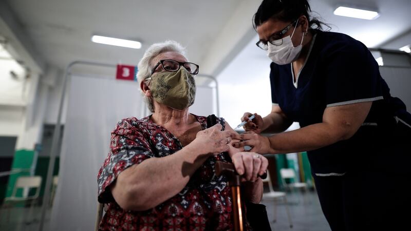 Justina Blanca Nuaez (81) is vaccinated against Covid-19 in Buenos Aires on Friday as Argentina began to deploy the vaccine for older adults after the arrival in recent days of more doses. Photograph:  Juan Ignacio Roncoroni/EPA
