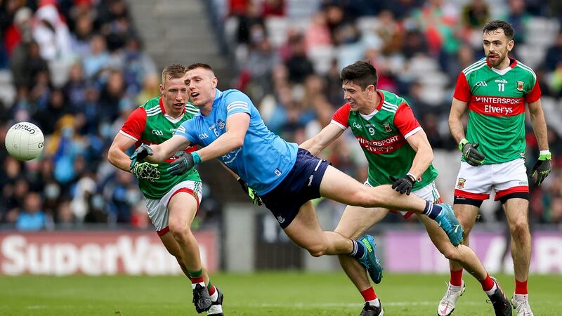 John Small is challenged by Mayo’s Ryan O’Donoghue, Conor Loftus and Kevin McLoughlin. Photograph: James Crombie/Inpho