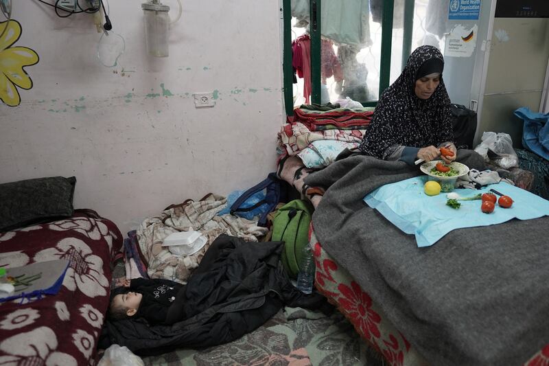 A Palestinian woman cuts vegetables near a sleeping boy at the Shuhada al-Aqsa Hospital in Deir el-Balah in the Gaza Strip on April 3rd. Photograph: AFP/Getty
