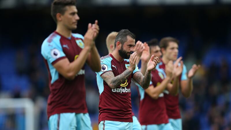 The Burnley team applaud their fans after the match. Photograph: Alex Livesey/Getty Images