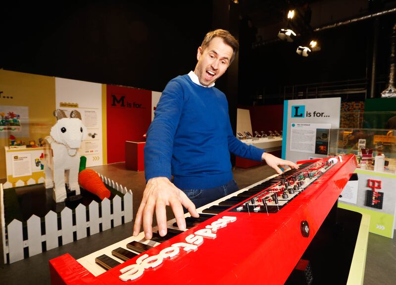 Newstalk presenter Kieran Cuddihy with a piano sculpture at the exhibition. Photograph: Leon Farrell/Photocall Ireland