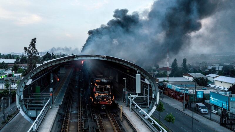 A burned metro station after protests in Santiago. Photograph: Javier Torres/Aton Chile/AFP via Getty