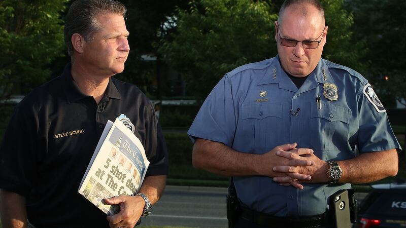 Anne Arundel County executive Steven Schuh and Anne Arundel County police chief Timothy Altomare give an interview near where five people were shot and killed by a gunman on Thursday. Photograph: Mark Wilson/Getty Images