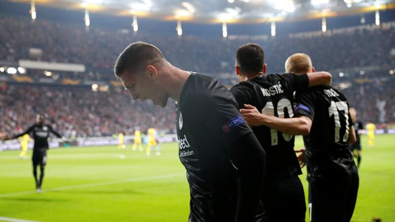 Luka Jovic celebrates scoring the first goal. Photo: Kai Pfaffenbach/Reuters