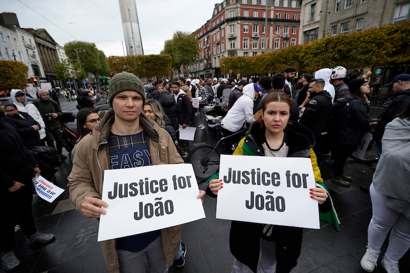 Members of the Brazilian community gather at the Spire in Dublin after a delivery driver Joao Ferreira was seriously injured in a collision with a Garda car on the M50 on Saturday. Photograph: Niall Carson/PA Wire