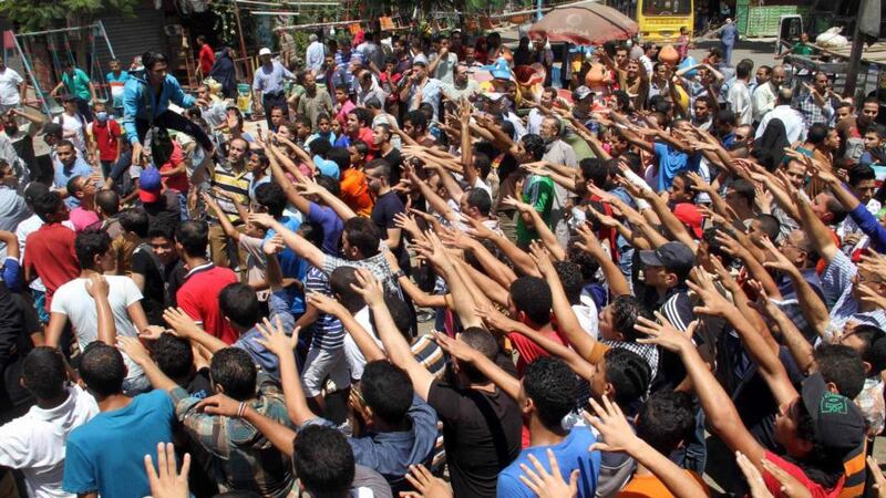 Supporters of the Muslim Brotherhood in the Matariya area in Cairo on the first anniversary of the clearing of the Muslim Brotherhood sit-in at Cairo’s Rabaa al-Adawiya, in which at least 817 protesters were killed when security forces stormed two protest.  Photograph: Reuters/Al Youm Al Saabi newspaper