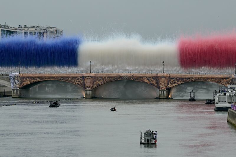 Fireworks in the French national colours explode over Pont d'Austerlitz during the opening ceremony of the Olympic Games. Photograph: Damien Meyer/AFP via Getty Images