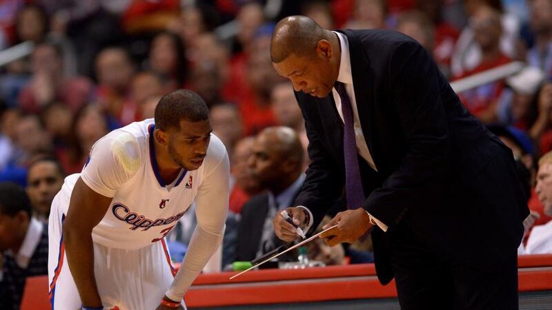 Los Angeles Clippers head coach Doc Rivers (right) shows a play to Chris Paul (left) during a recent game. Paul, who in addition to playing point guard for the Clippers is also president of the NBA Players Association,  said the tape was a very serious issue ‘which we will address aggressively’. Photograph: Paul Buck/EPA.