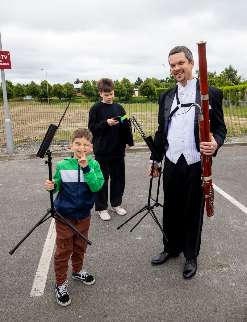 Vadym Supruniuk  and his sons Philip (eight) and Danill (14). Photograph: Tom Honan