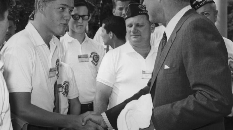 Future president Bill Clinton, shakes the hand of President John F. Kennedy during a trip to the White House in Washington DC. Photograph:  Arnold Sachs/Getty Images
