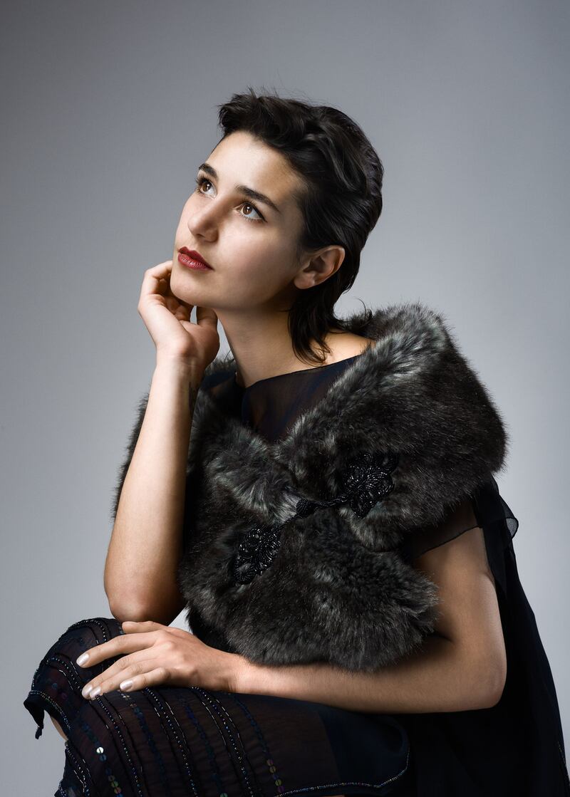 Fake fur stole, silk lined with beaded fastenings €140, Black