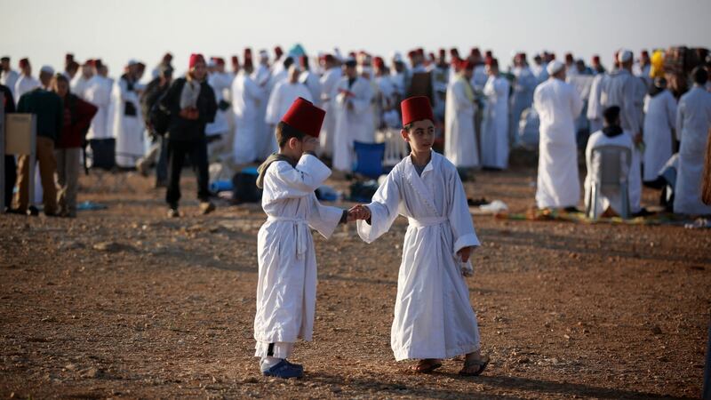 Samaritans, wearing traditional white clothes, gather at Mount Gerizim to celebrate the Sukkot holiday in Nablus on the West Bank. Photograph: Issam Rimawi/Anadolu Agency via Getty Images