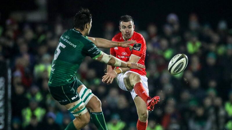 Munster outhalf JJ Hanrahan comes under pressure from  Connacht’s Quinn Roux during the Guinness Pro 14 clash at the  Sportsground on Saturday night. Photograph: Billy Stickland/Inpho