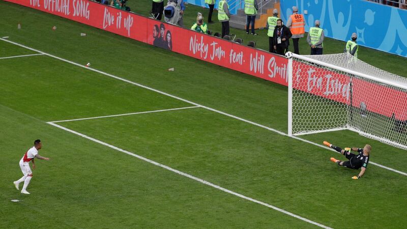 Peru’s Christian Cueva, left, fails to score on a penalty kick during the group C match between Peru and Denmark at the 2018 soccer World Cup in the Mordovia Arena in Saransk, Russia, Saturday, June 16, 2018. (AP Photo/Gregorio Borgia)