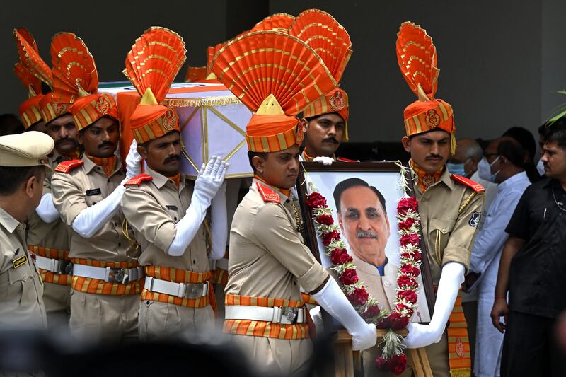Soldiers carry the coffin of Vijay Rupani, former chief minister of India's Gujarat state, who was killed in the Air India flight crash. Photograph: Dibyangshu Sarkar/AFP/Getty    