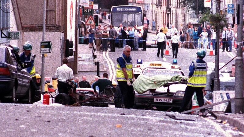 A body of one of the 21 dead is removed from the scene of the bombing in Omagh,  Co Tyrone