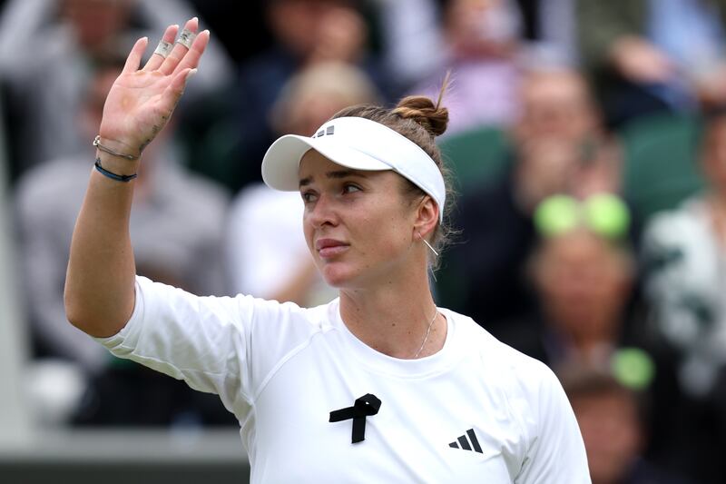 Elina Svitolina of Ukraine acknowledges the crowd as she celebrates match point. Photograph: Clive Brunskill/Getty