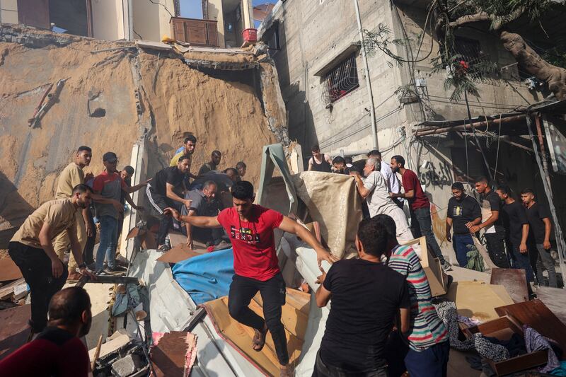 People search for survivors in the rubble of a building following Israeli bombardment at al-Bureij refugee camp in the central Gaza Strip on June 15th. Photograph: Eyad Baba/AFP via Getty