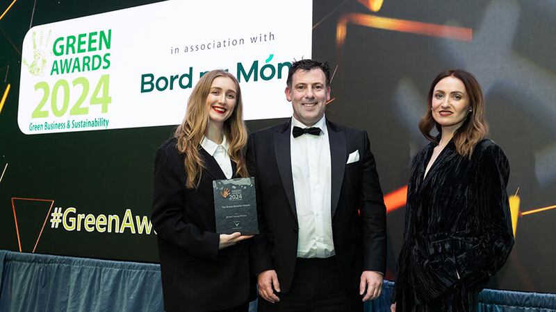 Paul Martin, chief executive at Verde Energy Group, presents the green retailer award to Khloe Dillon Coote and Ellie Heaney, Brown Thomas Arnotts