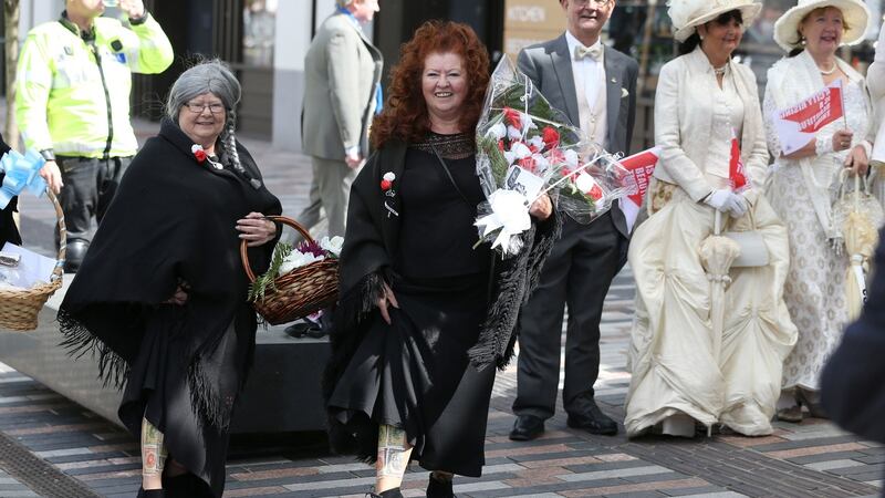 People in period costume wait for the Prince of Wales and the Duchess of Cornwall to arrive for a visit to the English Market in Cork as part of their tour of the Republic of Ireland. Photograph: Brian Lawless/PA Wire