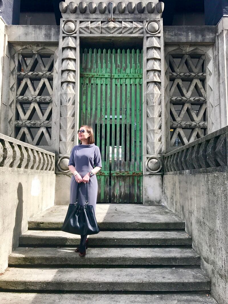 Grey dress by Helen McAlinden, bag by Holden Leather goods, cuff by Christina Belle. Photograph: Alison Carreon