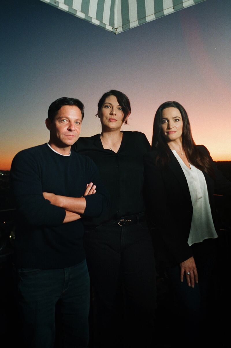 Taylor Jenkins Reid (centre), the author of Daisy Jones & the Six, with screenwriter Scott Neustadter and executive producer Lauren Neustadter. Photograph: Chantal Anderson/The New York Times