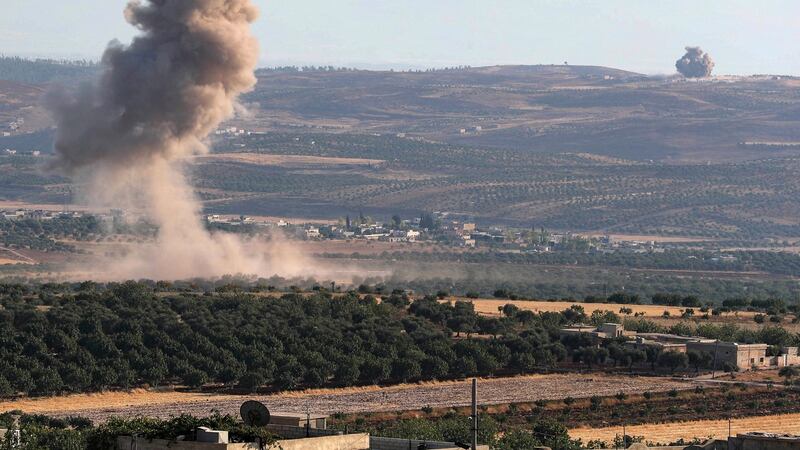 Smoke billows following  weekend air strikes on the village of Kafr Sajna in the southern outskirts of Syria’s Idlib province. Photograph: Omar Haj Kadour/AFP/Getty