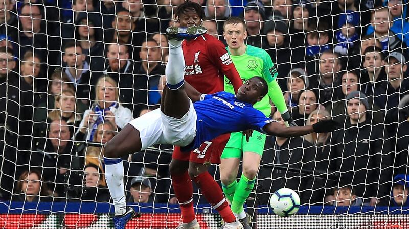 Kurt Zoma tangles with Divock Origi during Everton’s stalemate with Liverpool. Photograph: Peter Byrne/PA