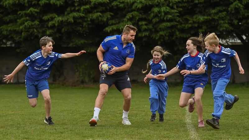 Leinster’s Jordan Larmour with, from left, Kaleb McCallister, aged 12, Fiadh Bel Molloy, aged 9, Holly O’Dell, aged 11, and James Mullrooney, aged 10, at St Mary’s College RFC in Dublin at the launch of the  Leinster Rugby Summer Camps. Photograph: Sam Barnes/Sportsfile