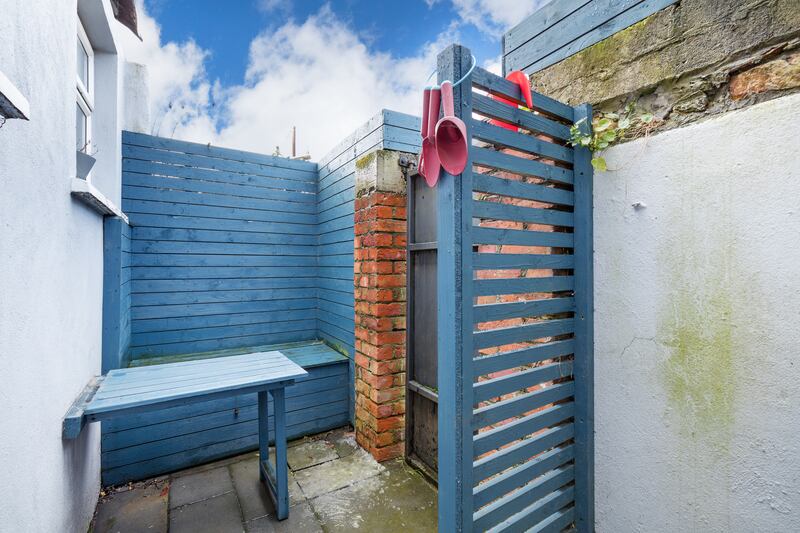 Storage bench and fold-away table in the small rear courtyard