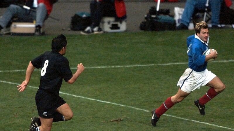 French winger Christophe Dominici  runs to score a try against New Zealand during a World Cup semi-final match in 1999 – the match is considered one of the greatest games played. Photograph:  Odd Andersen/AFP via Getty Images