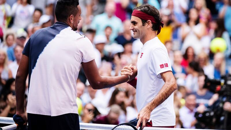 Roger Federer meets Australia’s Nick Kyrgios at the net after his third round US Open victory. Photograph: Karsten Moran/NYT