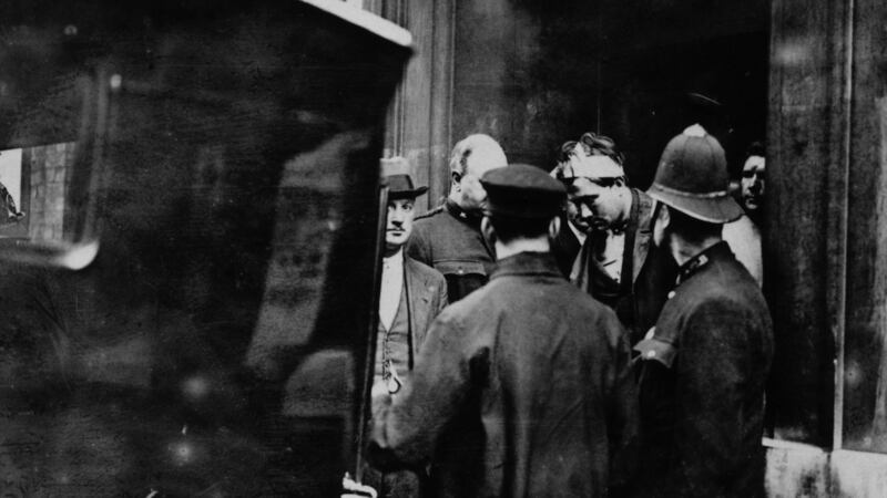 The arrest of Reginald Dunne (with bandaged head) and James Connolly immediately after the assassination in London by the two IRA gunmen of British field marshal Henry Wilson. His assassination helped spark off the Irish Civil War. Photograph:  Topical Press Agency/Getty Images