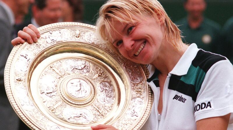 Novotna with the gold plate after winning the ladies title at Wimbledon in 1998. Photo: EPA