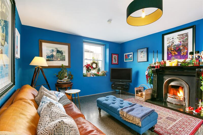 The blue reception room to the front of the property is the only part of the original house still standing on the ground floor