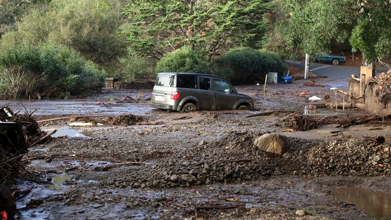 A car is trapped in a mudslide following heavy rains in Montecito, California/ Photograph: Mike Nelson/EPA