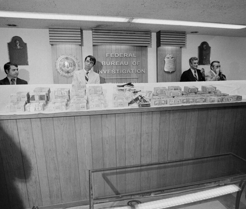 Recovered ransom money and guns used in the kidnapping. Photograph: Paul Hosefros/The New York Times
