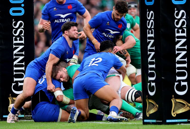 France’s Julien Marchand holds up Ireland's Iain Henderson. Photograph: James Crombie/Inpho