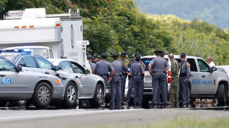 Virginia State Police vehicles on  Highway I-66 in Fauquier County, Virginia, where shooting suspect 41-year-old Vester Flanagan shot and fatally wounded himself several hours after two television journalists were shot and killed during a live broadcast in Virginia on Wednesday. Photograph: Kevin Lamarque/Reuters