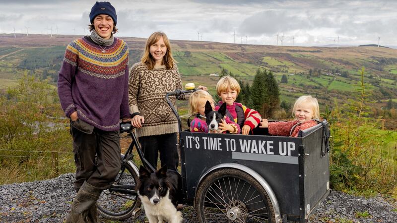 Fynn and Holly Hopper and their three children Kimball (seven), Noomi (five) and Iduna (three) with the bike that Holly uses to transport the children.  They moved from Hull in England to the top of Kilronan mountain overlooking the Arigna valley in Co Roscommon. Photograph: James Connolly
