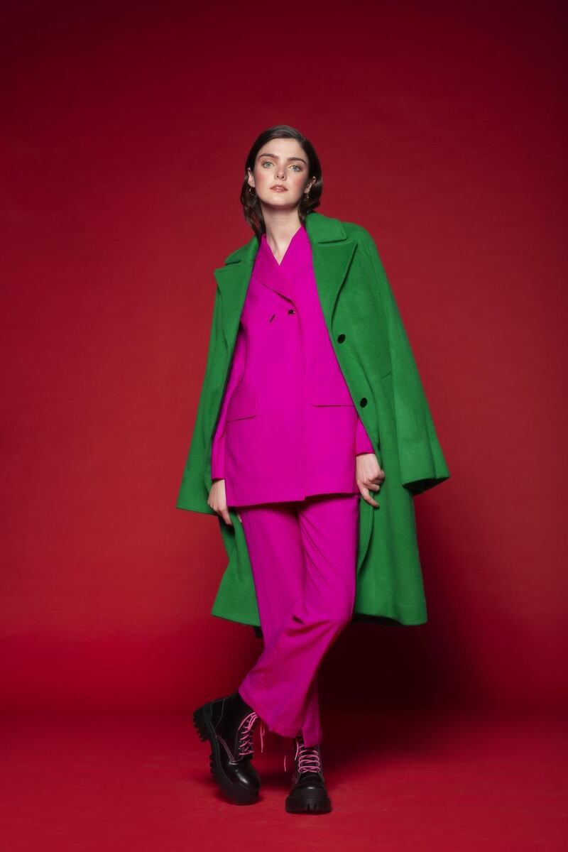 Hoop earrings, €75, Gorjana, Loulerie; wool green coat, €800, Custom-made, Arnotts; pink tailored blazer, €710, trousers, €480, both Eudon Choi, Beautiful South; chunky boots, €750, Balenciaga, Brown Thomas