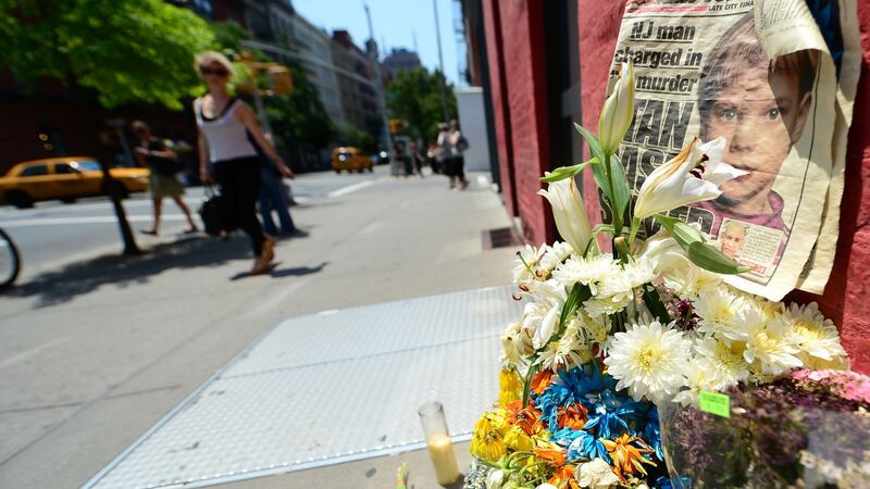 People walking past a shrine in 2012 to six-year-old Etan Patz, who disappeared on May 25th, 1979, set in front of the building in New York where Pedro Hernandez confessed to strangling the boy. Emmanuel Dunand/AFP/Getty Images