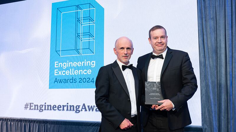 Michael Connelly, awards judge, presents the graduate training programme of the year award to Barry O'Sullivan, Kirby Group Engineering