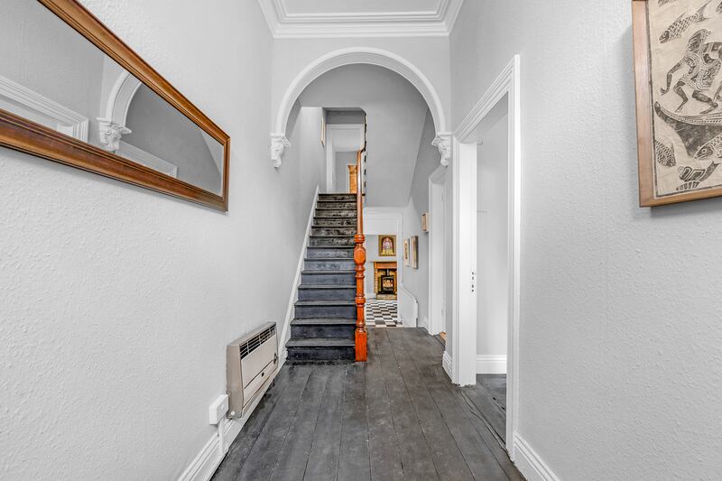 Two reception rooms lie off the hallway