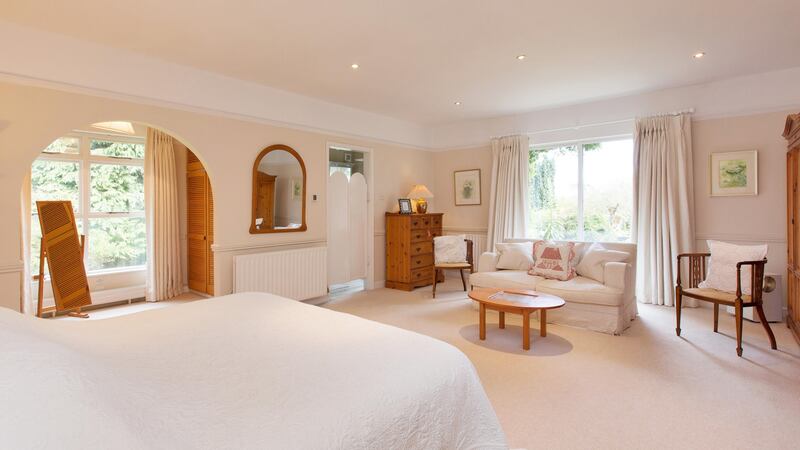 The master suite with patio doors to the gardens at Edelehr