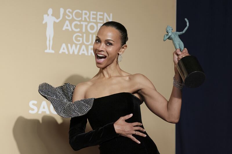 Zoe Saldana  with the SAG award for Outstanding performance by a female actor in a supporting role. Photograph: Allison Dinner/EPA