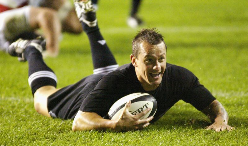 Spencer slides across the line for a try during the New Zealand versus England rugby union international at Eden Park on June 19th, 2004 in Auckland. Photograph: Dean Treml/Getty