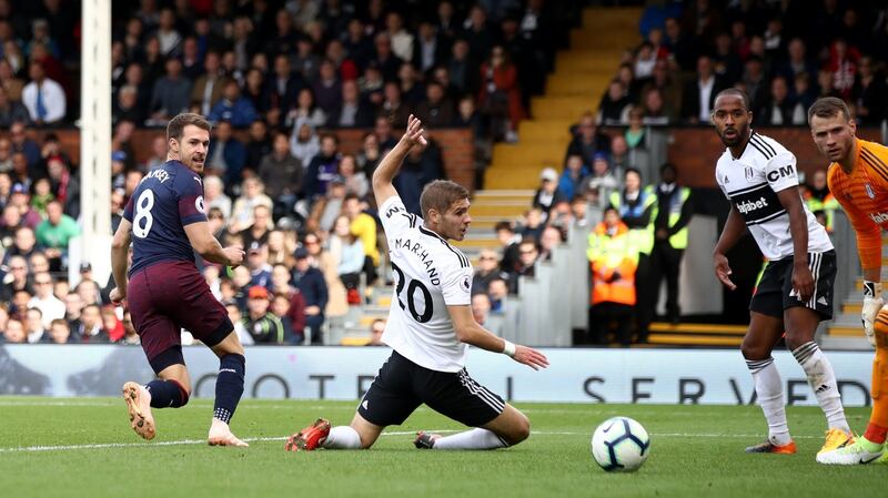 Aaron Ramsey backheels Arsenal’s thrid home against Fulham. Photograph: John Walton/PA