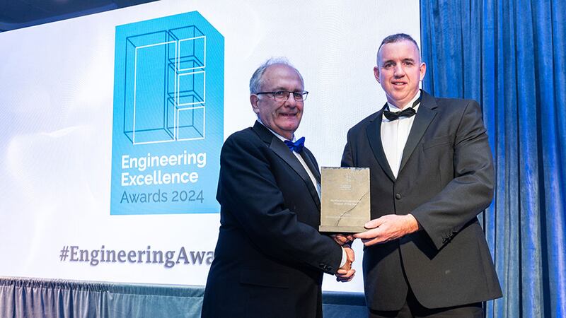 Matt Cotterell, awards judge, presents the mechanical engineering project of the year award to Joseph Watkin, EPS Group