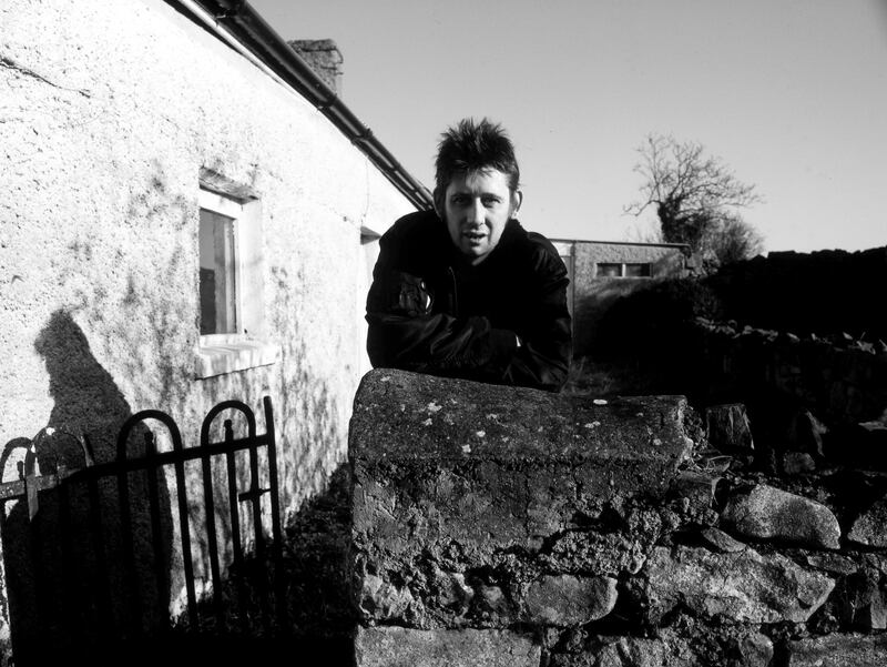 Shane MacGowan at the family home in Nenagh, Tipperary in 1997. MacGowan's parents moved back to Ireland in 1988 after 30 years in England, where Shane was born and grew up. Photograph: Martyn Goodacre/Getty Images